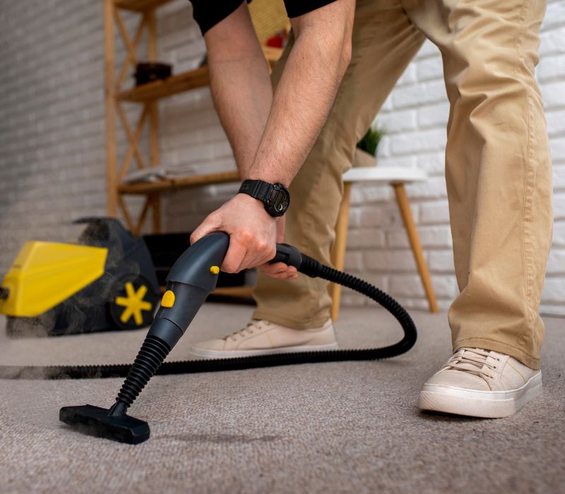 boy using vacuum for carpet cleaning